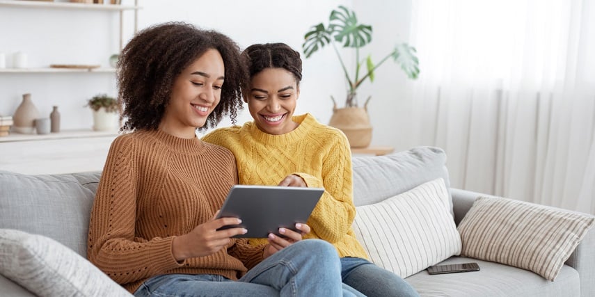 Adult sisters browsing products through 360 photo view web tools