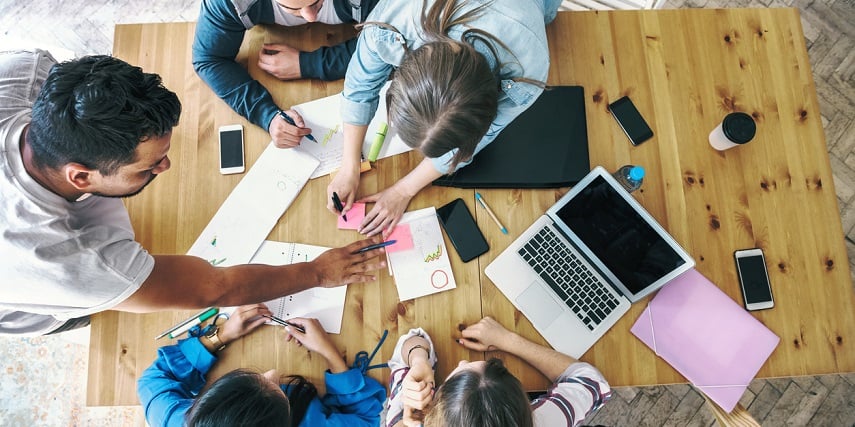 Aerial shot of marketers brainstorming ways to use a 360 product viewer