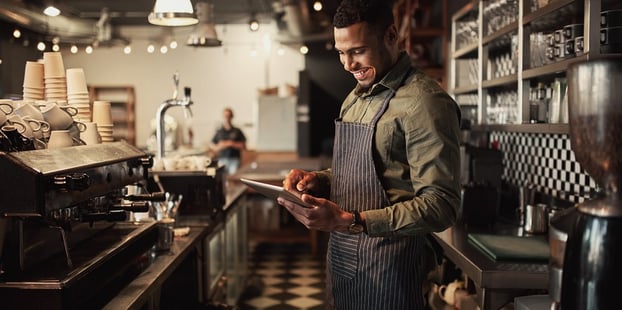 Cafe owner using a Salesforce product configurator to buy new furniture