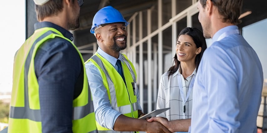 Construction workers discussing changes planned in a 3D house configurator