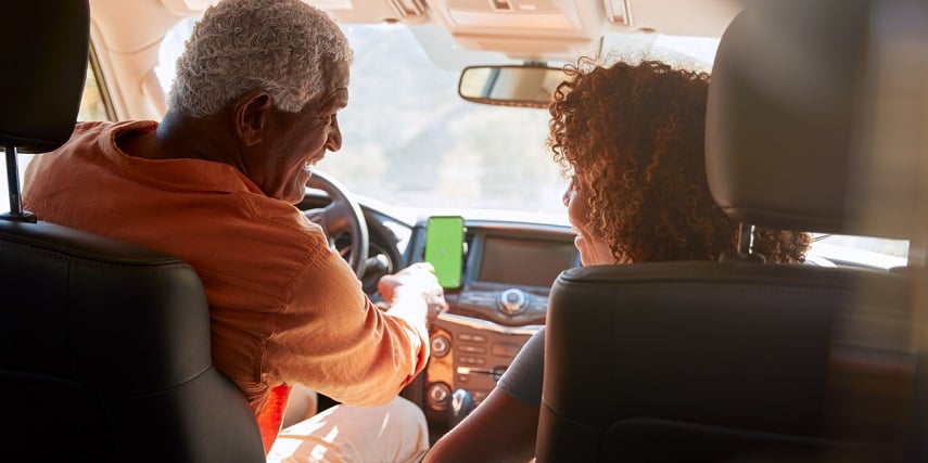 Couple driving in a car augmented with purchases made through a 3D car customization online tool