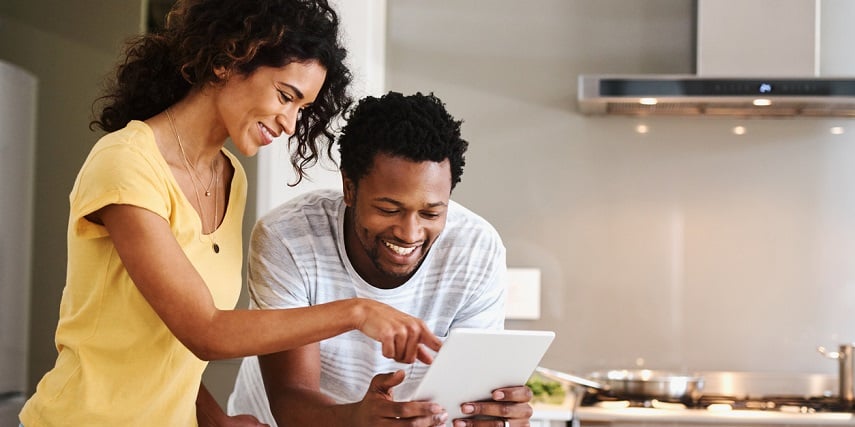 Couple looking at furniture online through a product configurator