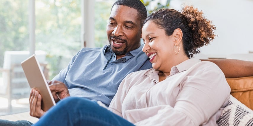 Couple looking at product images generated through virtual photography