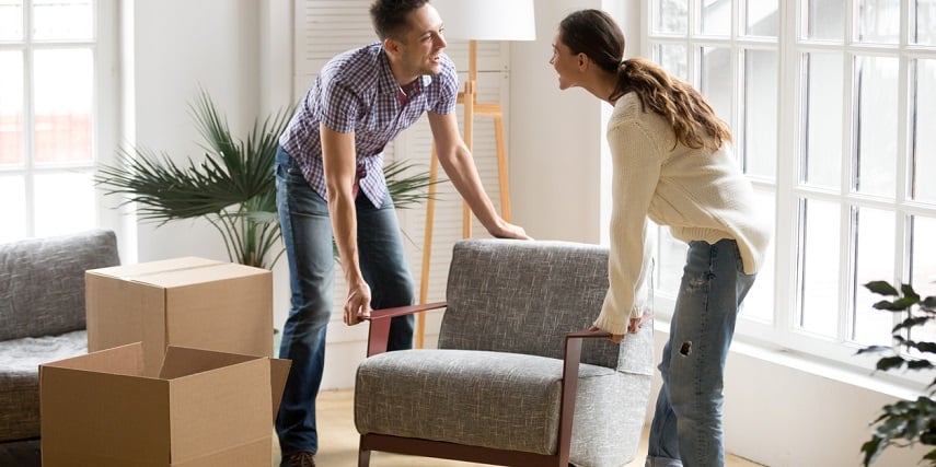 Couple moving a chair they purchased through AR for eCommerce