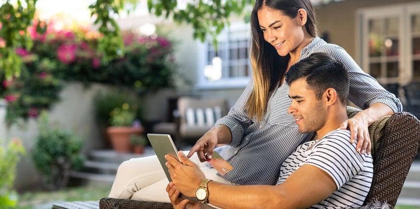 Couple using AR for eCommerce to shop for new patio furniture