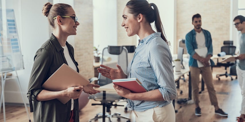 Coworkers discussing new data results from their product customizer