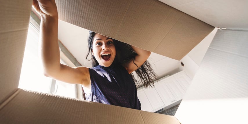 Customer opening a package with a product she ordered through a 360 product viewer