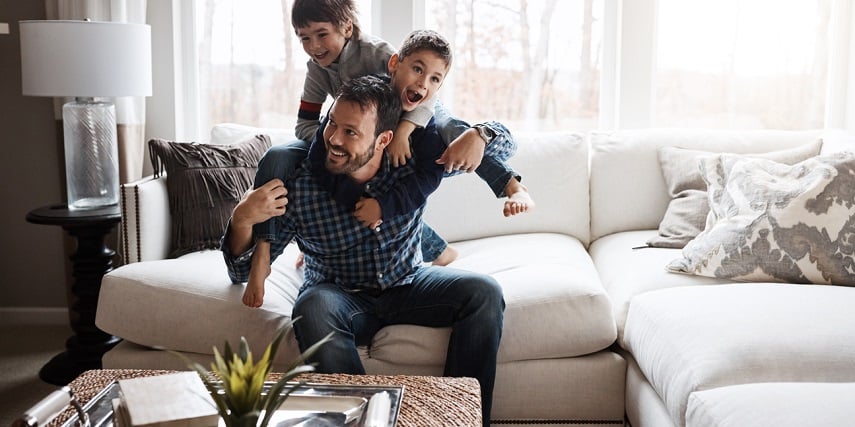 Family playing on a new couch ordered through a 3D furniture configurator