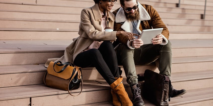 Fashionable friends looking at custom shoes in a shoe configurator