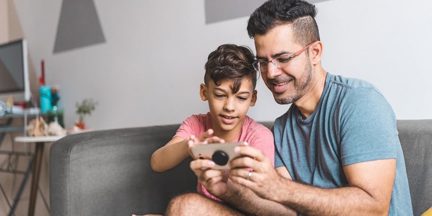 Father and son shopping for clothes online through an apparel configurator