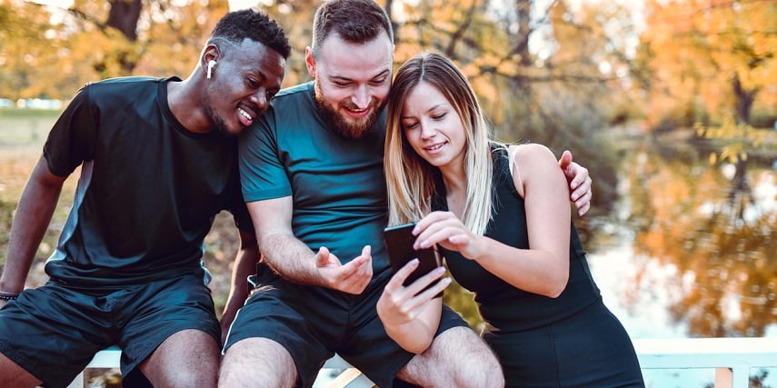 Group of athletic friends browsing options in a shoe configurator