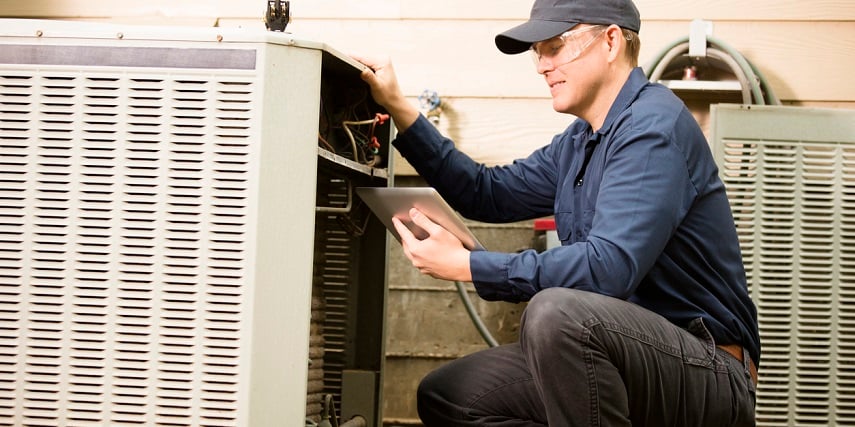 HVAC repair technician using a product customizer to order replacement parts