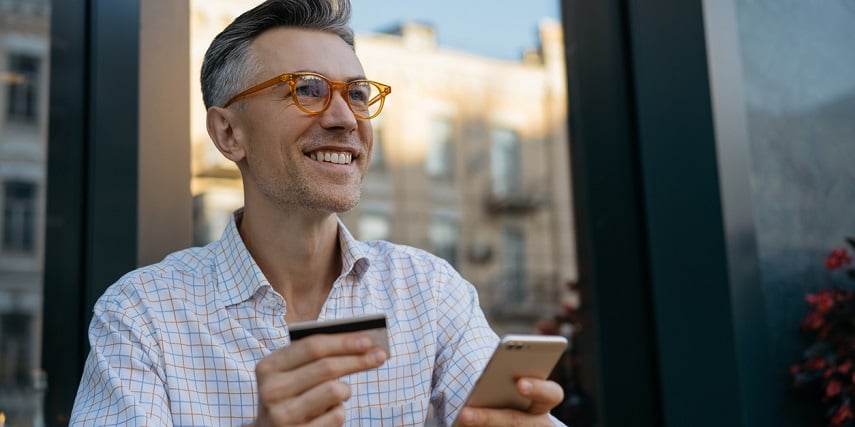 Happy shopper buying new glasses after a virtual try-on