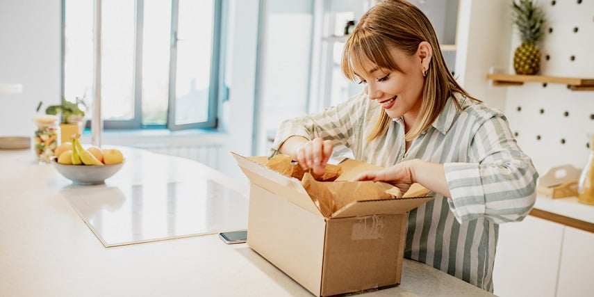 Happy shopper receiving their product in the mail