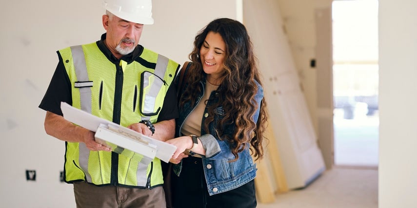 Homeowner and contractor discussing plans made in a 3D house configurator