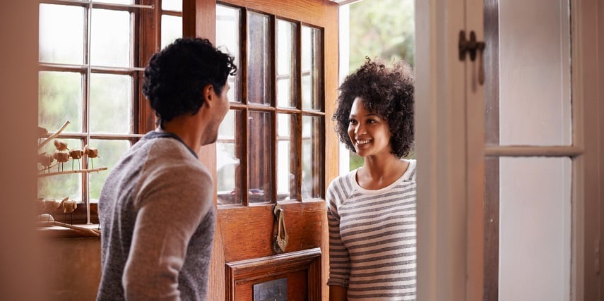 Homeowner enjoying the custom front door they designed in a Salesforce product configurator