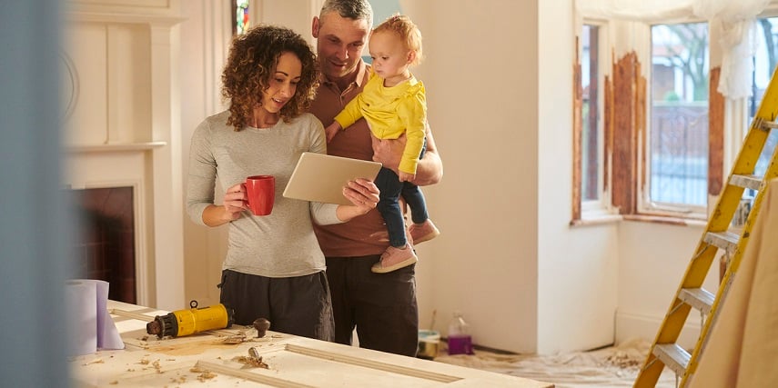 Homeowners browsing remodeling options in a 3D house configurator