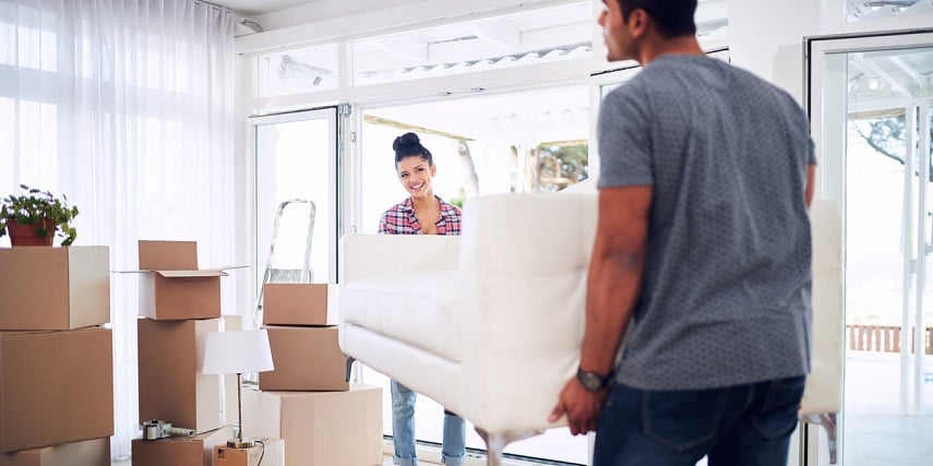 Homeowners moving the new couch they designed through a couch configurator