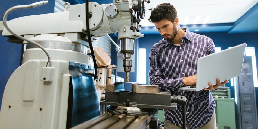 Industrial machine technician using a product customization tool to purchase replacement parts