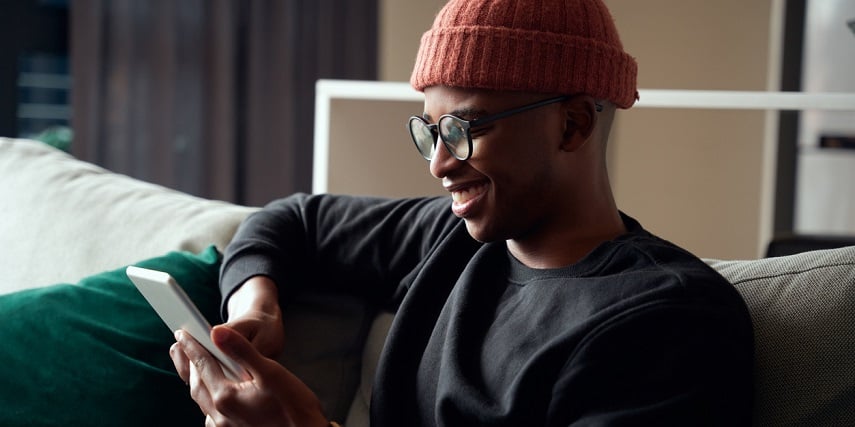 Man customizing a furniture set through a product customizer with room builder technology