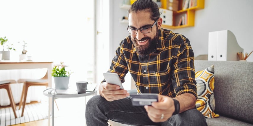 Man making an online purchase at home