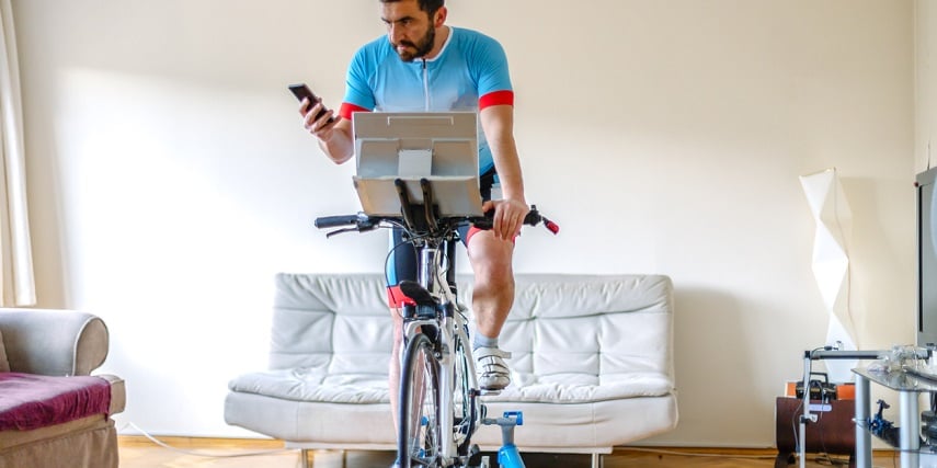Man on an exercise bike that was customized through SAP product configuration