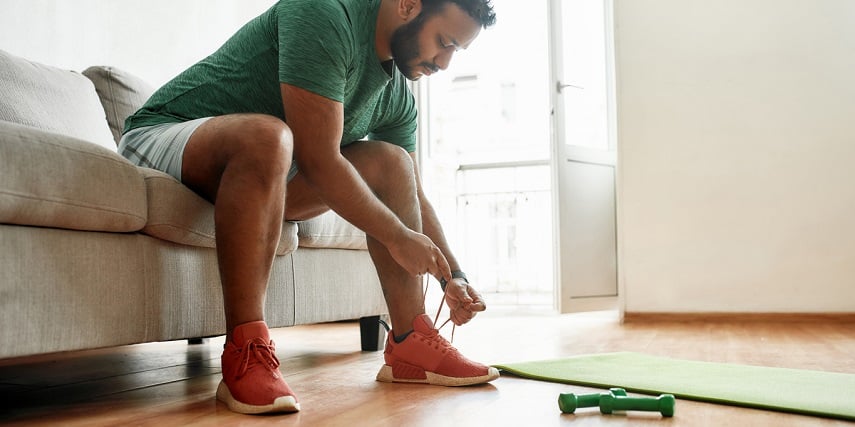 Man putting on custom sneakers made in a sneaker configurator