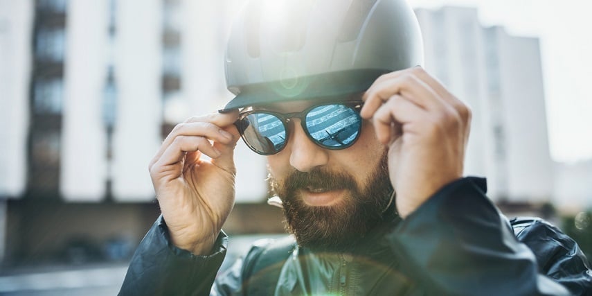 Man putting on new sunglasses after a virtual try-on