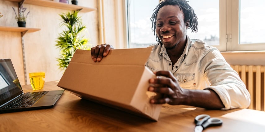 Man receiving an impulse bought package he customized through a BigCommerce product configurator