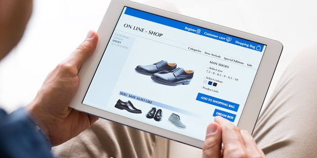 Man shopping for shoes in an online store