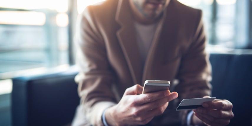 Man shopping online for a wallet through a BigCommerce product configurator