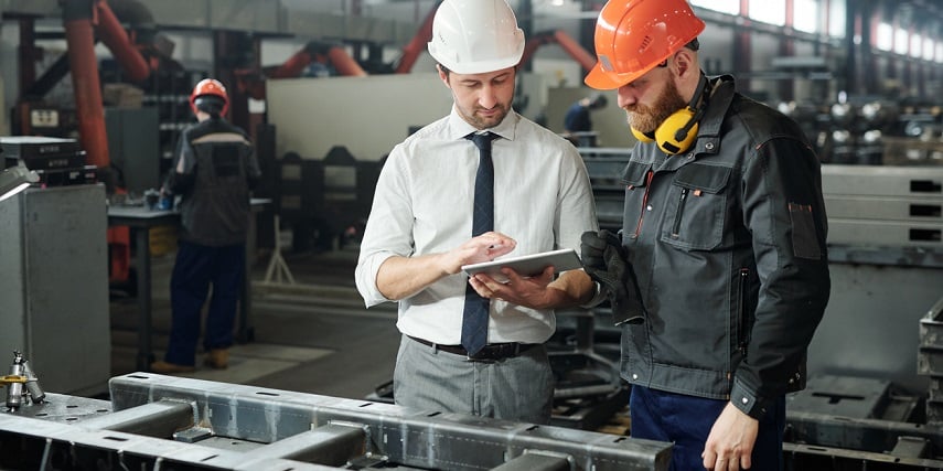 Manufacturing team reading design specs from a 3D cylinder configurator