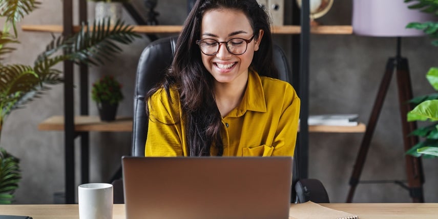 Shopper enjoying new office furniture she chose through a Magento 360 product view tool