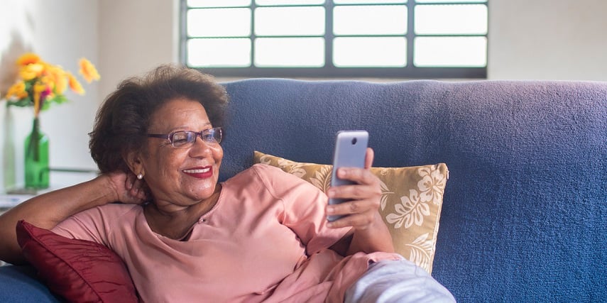 Shopper looking at AR furniture through a product configurator on her phone