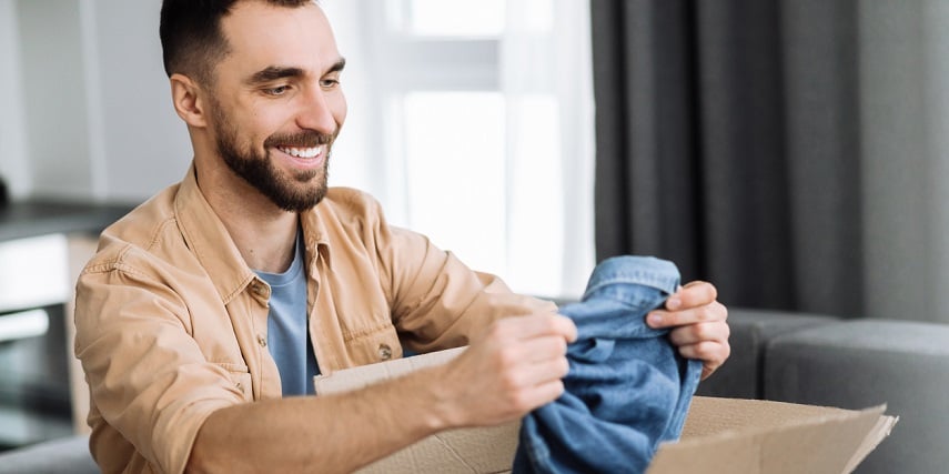 Shopper looking at a denim jacket he personalized in an apparel configurator