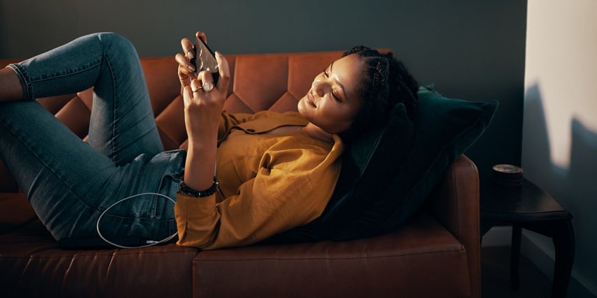 Shopper relaxing as she browses through a visual configurator