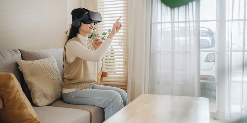 Shopper using VR for furniture technology at home