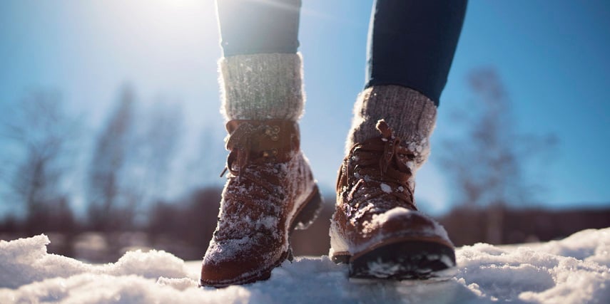 Shopper wearing snow-proof winter boots she bought through a visual configurator