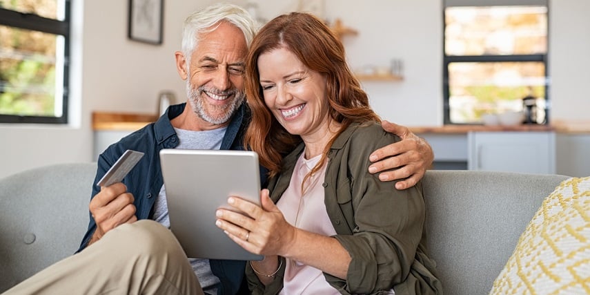 Shopping couple having fun with an online product configurator at home