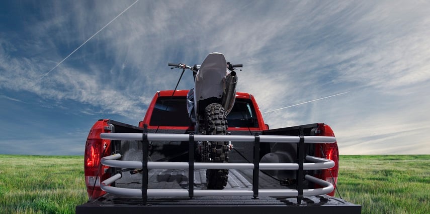 Truck carrying a motorbike with hardware created by 3D car customization online