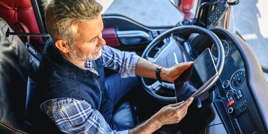 Truck driver using 3D car customization online to find accessories for his truck