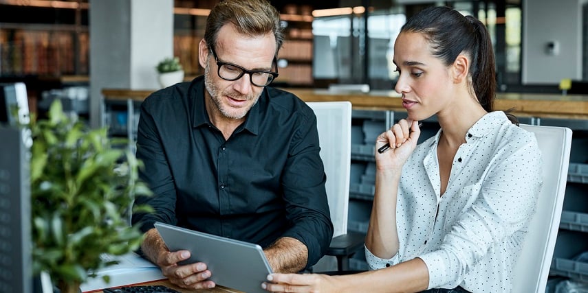 Two professionals looking at a product configurator to design modular building elements