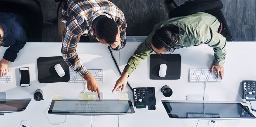 Two sales managers assessing progress based on Salesforce product configurator data