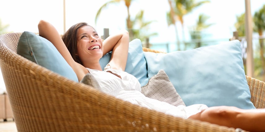 Woman enjoying custom patio furniture made through a 3D furniture configurator