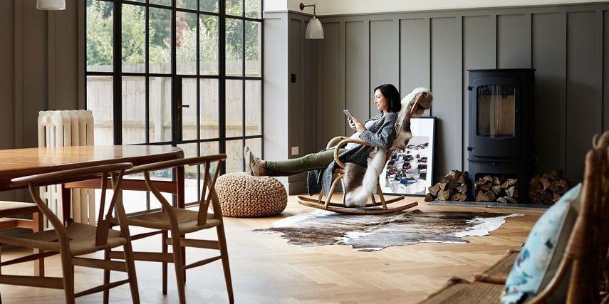 Woman relaxing in a beautifully furnished living room