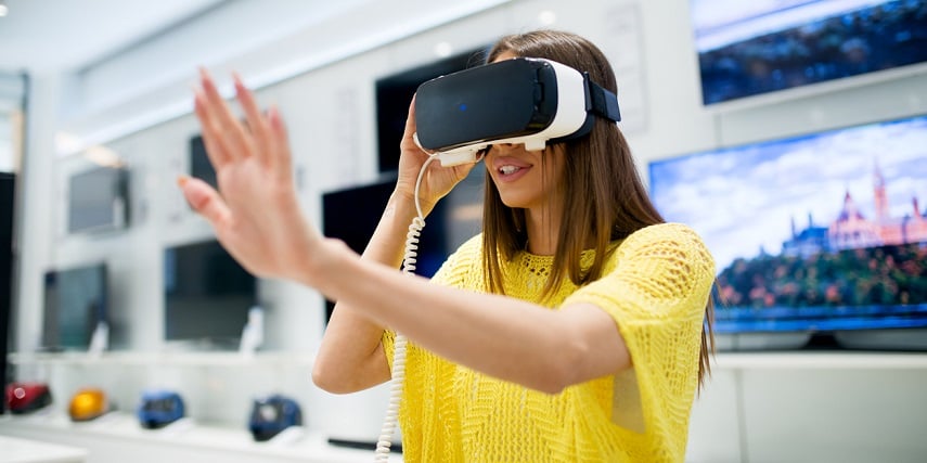 Woman using VR for furniture shopping in a store