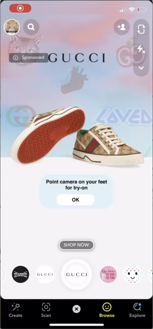 A mobile view of the Gucci AR-powered campaign showing a pair of shoes and prompting users to point the camera to their feet to try them on shoes