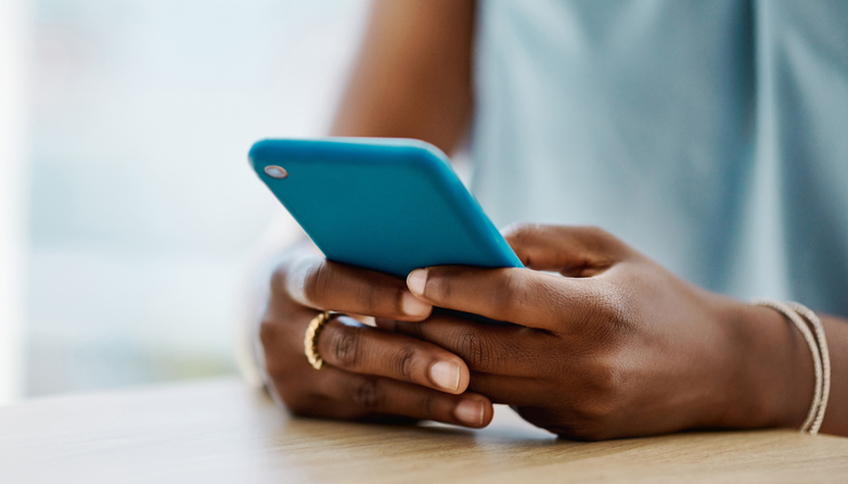 African woman using a cellphone-1394347332