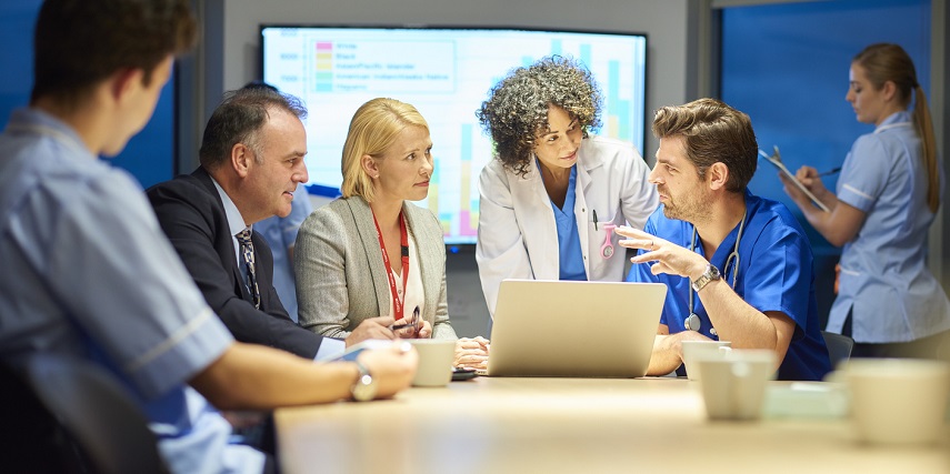 Team of medical administrators using a 3D customizer to optimize their lab equipment